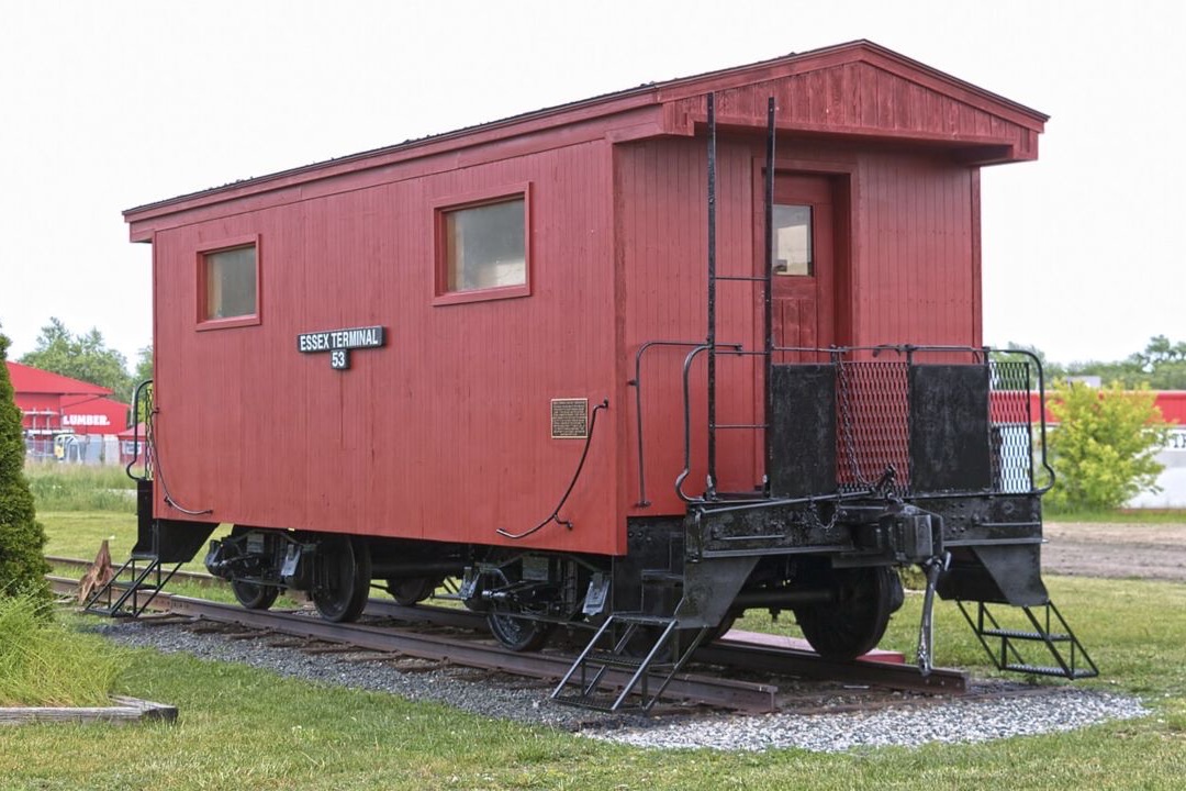 Essex Terminal Railway caboose beside the historic station