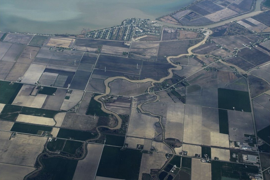 Aerial view of the fields, waterways, and marina at Lighthouse Cove in Lakeshore