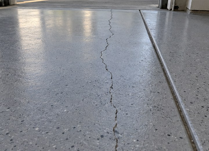 Movement below the coating — visual example for Why epoxy floors peel, bubble or fail